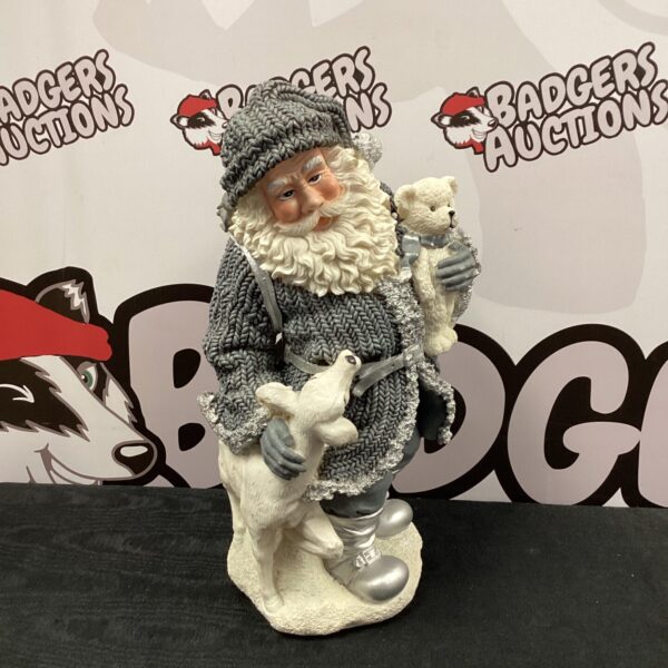 Detailed 16” resin Father Christmas ornament with animal companion.