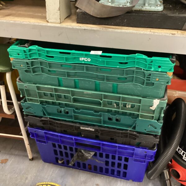 Lot of six plastic storage crates for organisation and storage.