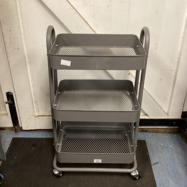 Three tier metal trolley on wheels for storage.