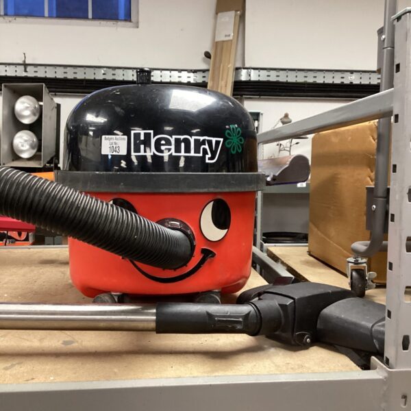 Red Numatic Henry vacuum cleaner, classic domestic cleaning appliance.
