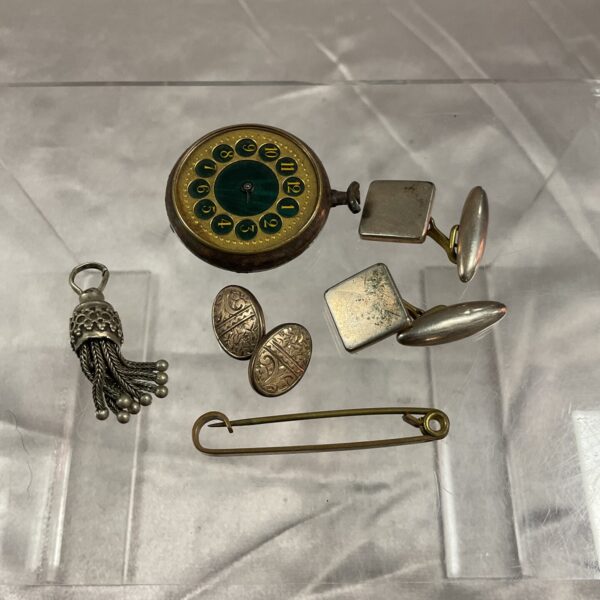 Antique pocket watch and vintage curios lot for collectors.
