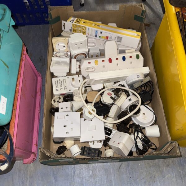 Mixed lot of plug sockets, timers and adapters for electrical use.