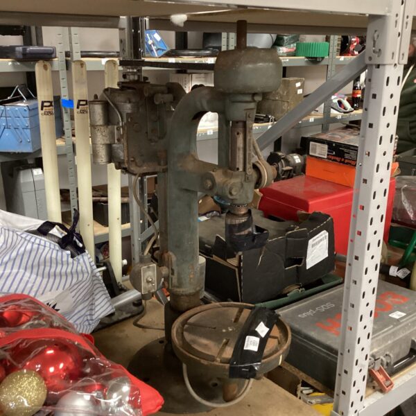 Antique pillar drill with chuck, vintage metalworking tool.