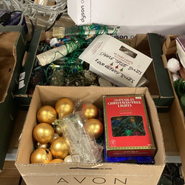 Mixed lot of Christmas lights and colourful baubles for festive decoration.