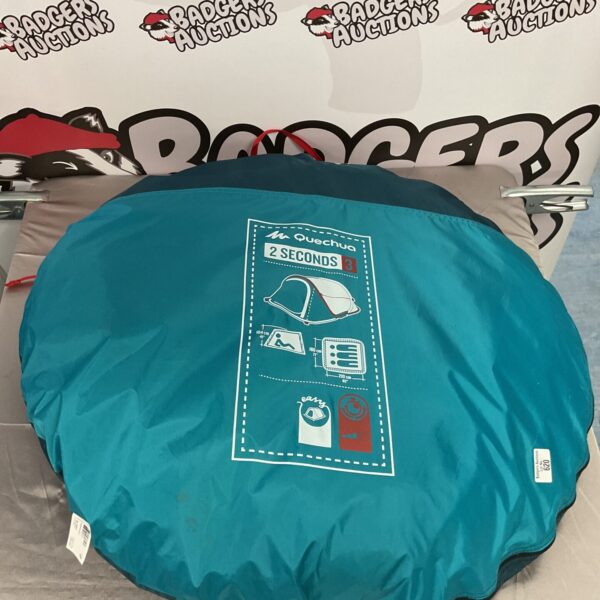 Used Quechua 2 Seconds pop up tent for camping and outdoor adventures.