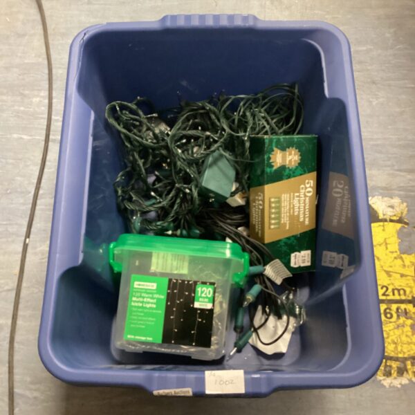 Mixed lot of Christmas tree lights in a plastic tub.