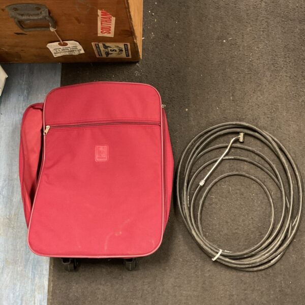 Dark grey Vincelli wheel bag with tyre inflator and hose inside.