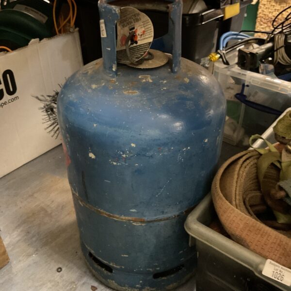 Blue Calor Gas tank, 15kg propane cylinder for outdoor use.