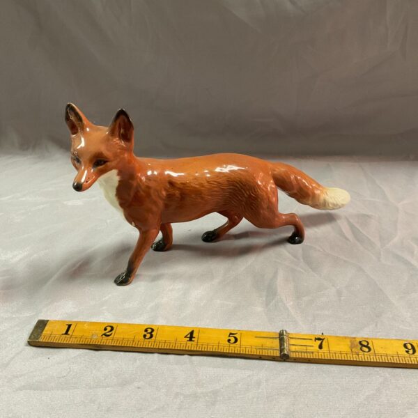 Vintage Beswick fox figurine, detailed ceramic animal collectible.