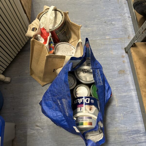 Lot of paint and grout for DIY projects.