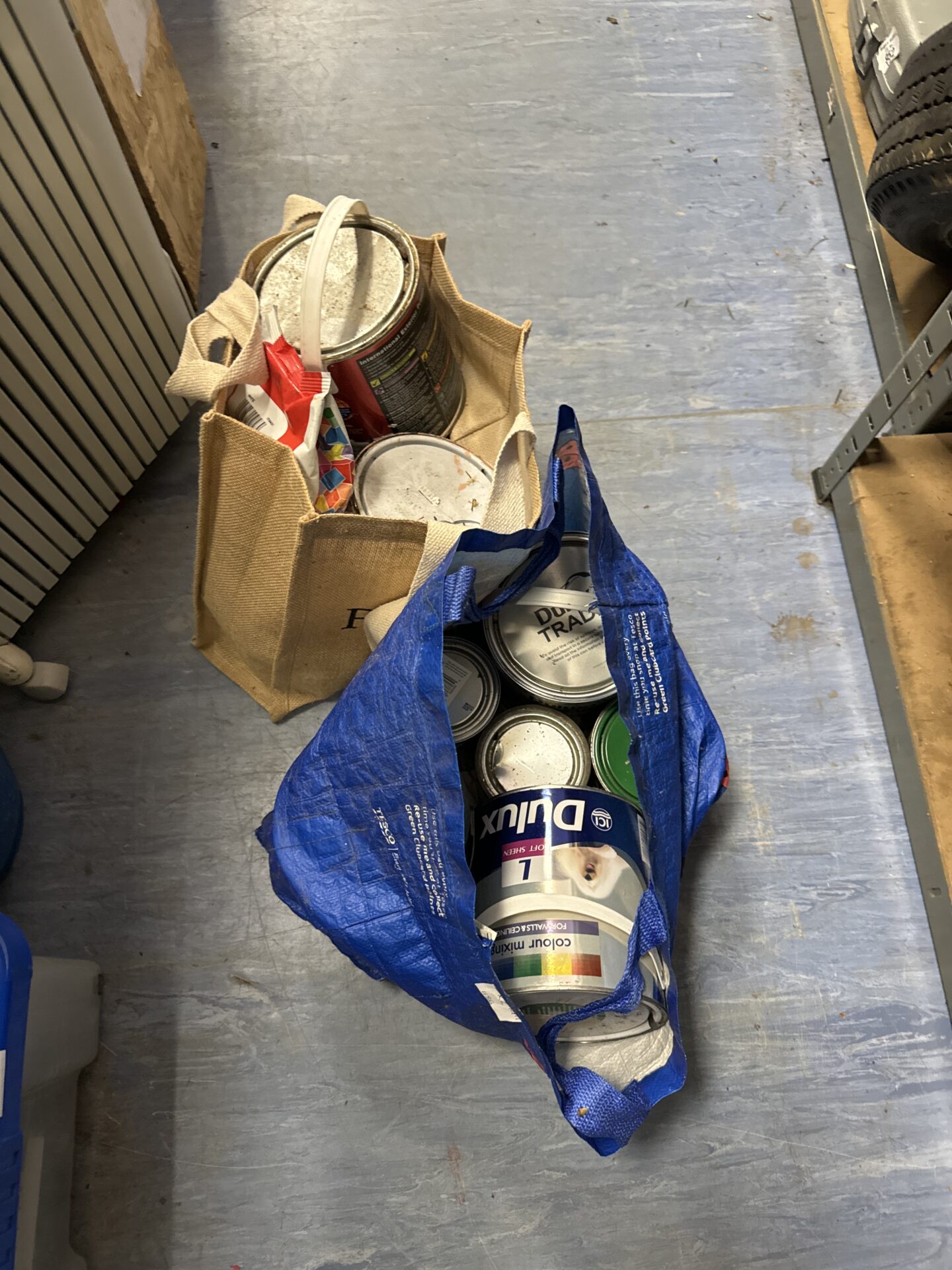 979 Quantity of paints (some sealed) with sealed bag of grout
