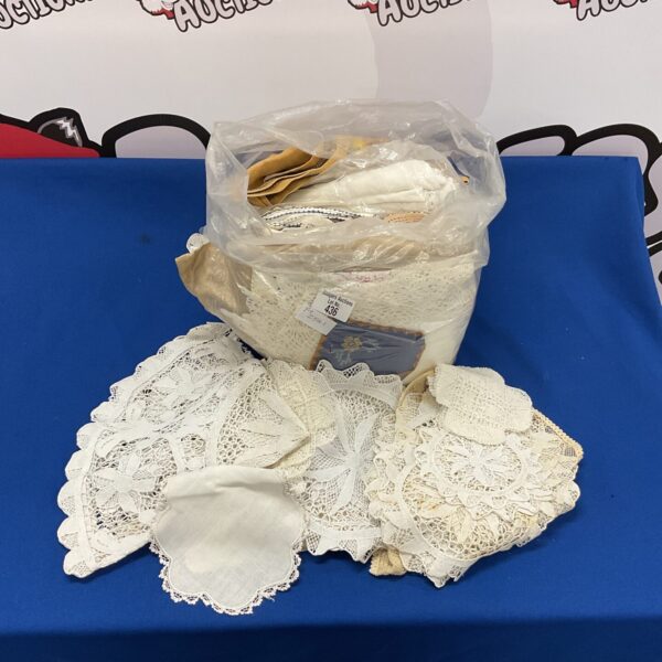 Vintage lace doilies in a mixed lot, delicate antique textiles.