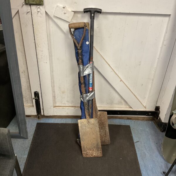 Vintage garden tools selection including a spade and fork.