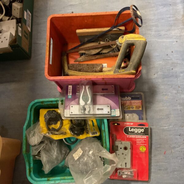 Mixed hardware lot with tools, nails, and a Chubb lock.