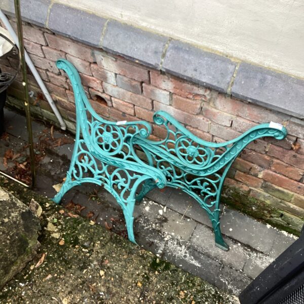 Intricate floral design on antique metal bench ends.