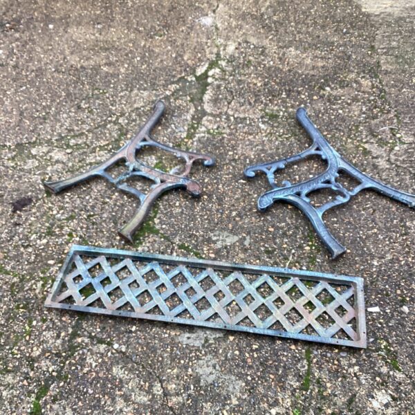 Vintage metal garden bench kit with decorative lattice back.