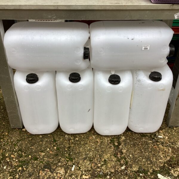 Six plastic 25l water jerry cans for outdoor use.