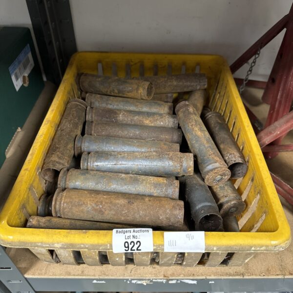 Tray of vintage cannon shells, antique military ordnance.