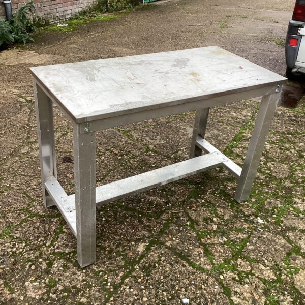 Durable stainless steel industrial bench for workshop or garden use.