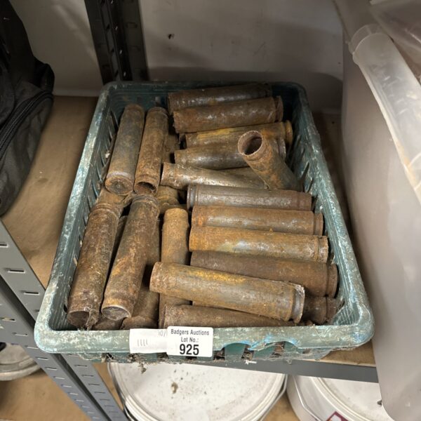 Tray of vintage iron cannon shells for collectors.
