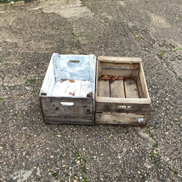 Vintage wooden fruit crates for farmhouse decor and storage.