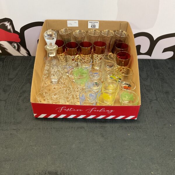 Vintage shot glass collection with colourful glassware.