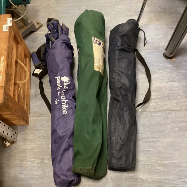 Three folding camping chairs ready for outdoor use.