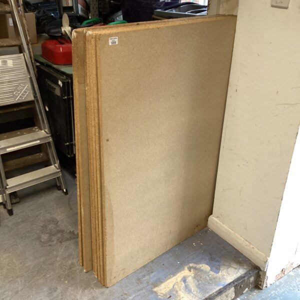 Lot of seven wood chip board sheets for DIY projects.