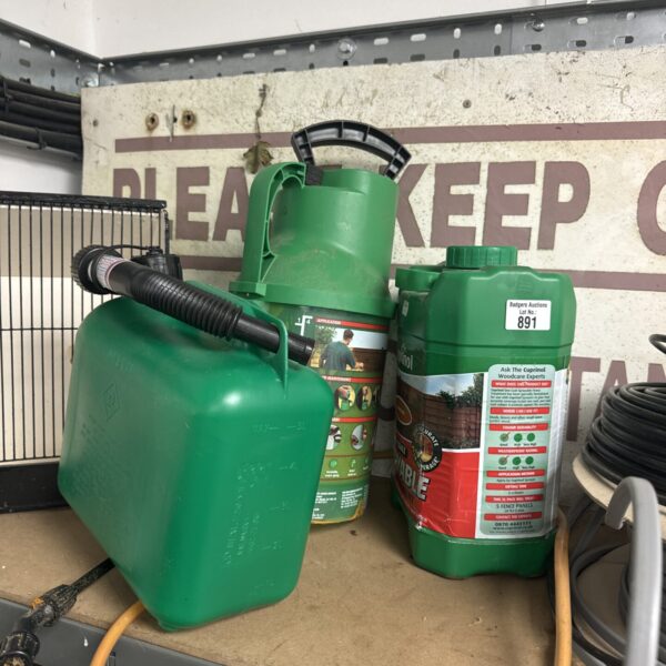 Plastic jerry can with pump sprayer and Cuprinol autumn gold paint.