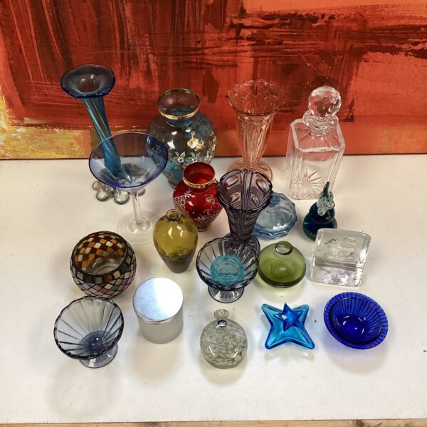 Vibrant collection of vintage and decorative coloured glass pieces.