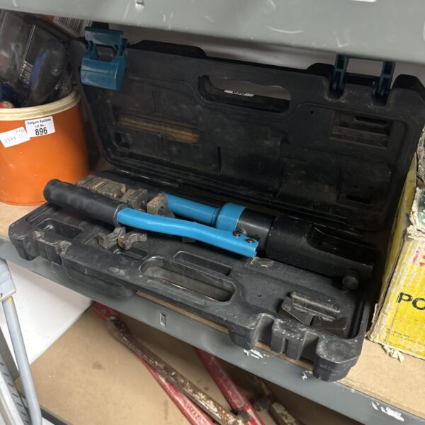 Large zipper cable crimping tool with insulated handles.