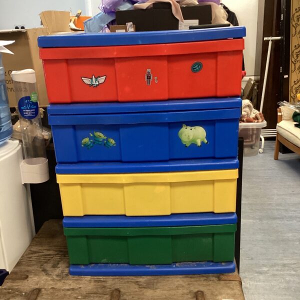 Colourful plastic childs toy chest of drawers for storage.