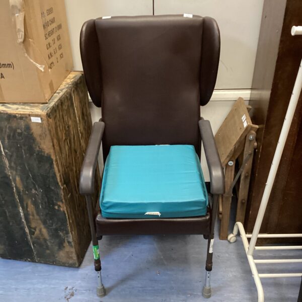 Padded NRS care chair with adjustable features, front view.