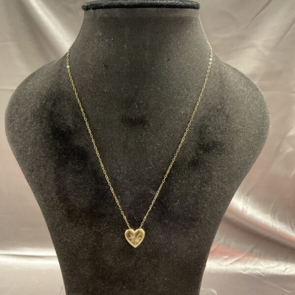Delicate 9ct gold heart pendant on a 16 inch chain.