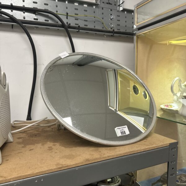 Large convex driveway mirror for enhanced visibility and safety.