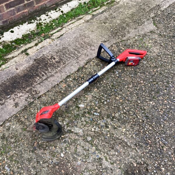Einhell Power Maxx cordless strimmer for garden maintenance.