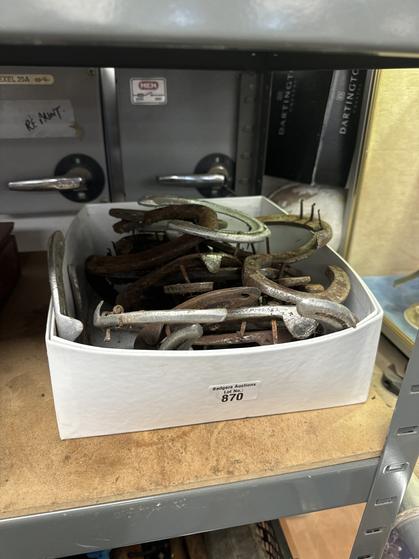 870 Tray of horseshoes