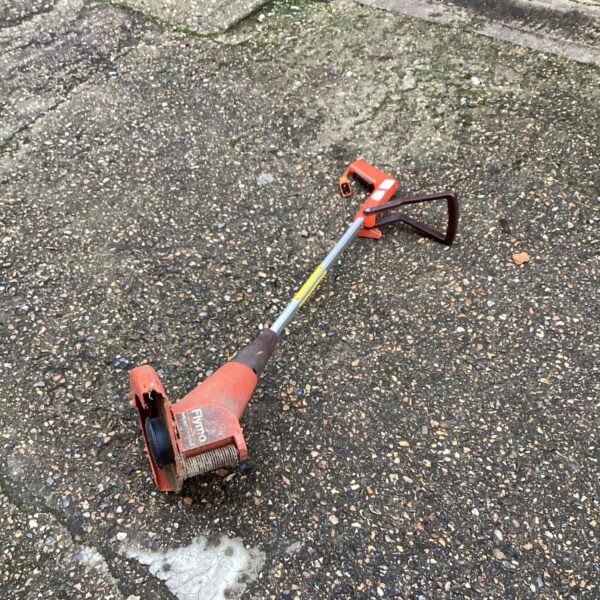 Used Flymo electric strimmer for garden maintenance and lawn edging.