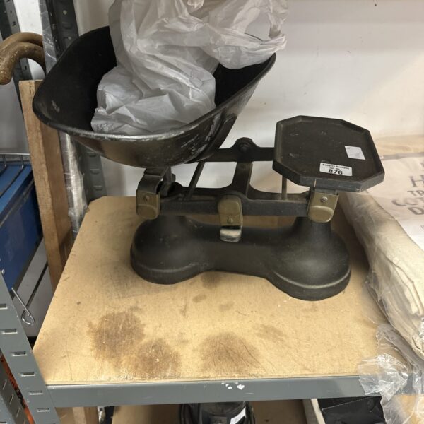 Vintage balance scales with a cast iron platform and arm.