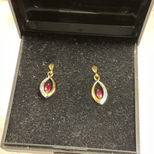 Vintage 9ct gold earrings with red stone settings.