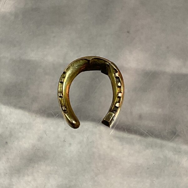 Delicate 9ct gold horseshoe charm for jewellery making.