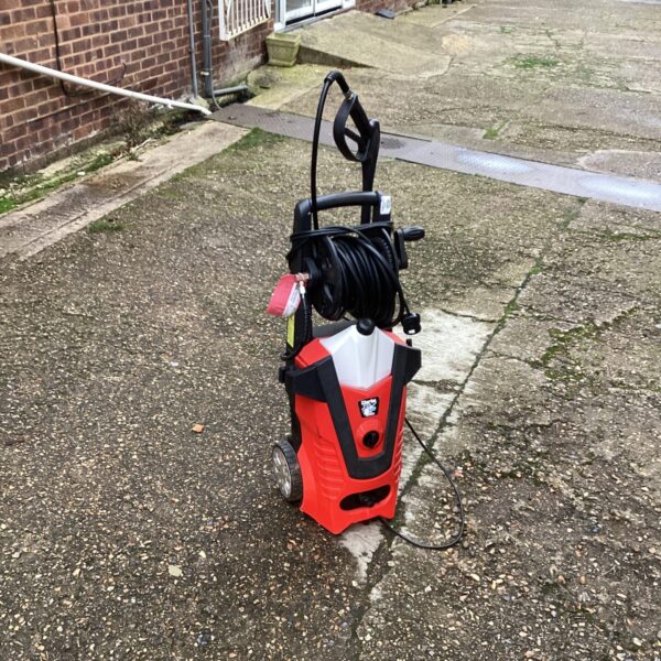 Red and black Clarke Jet Wash pressure washer on wheels.