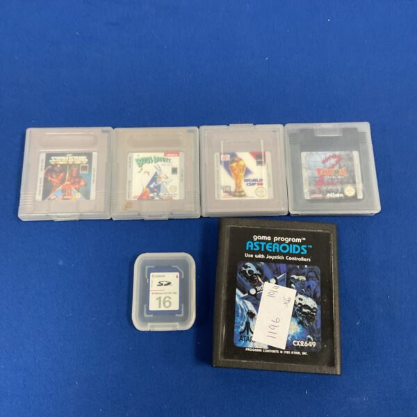 Vintage Game Boy games lot featuring Tetris and Asteroids.