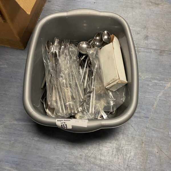 Mixed cutlery lot with stainless steel forks, knives and spoons.