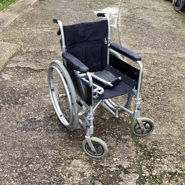 Silver Enigma folding wheelchair with black seat and back.