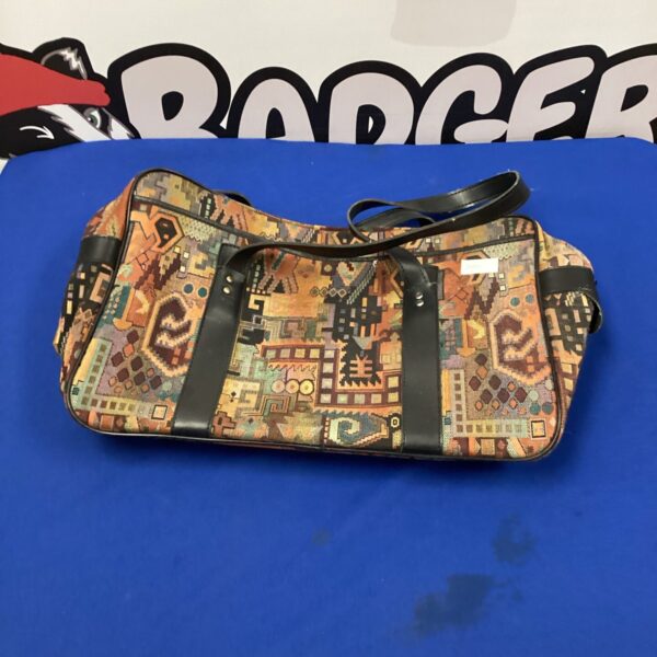 Colourful vintage shopping bag with a patterned fabric design.