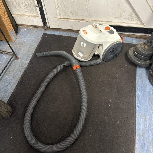 Used Vax cylinder vacuum cleaner with a crushed hose.