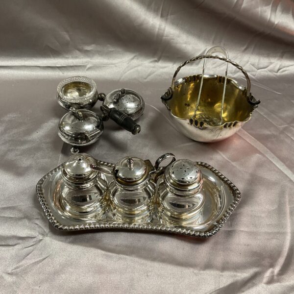 Vintage silverplate cruet set with bon bon dish and sugar tongs.
