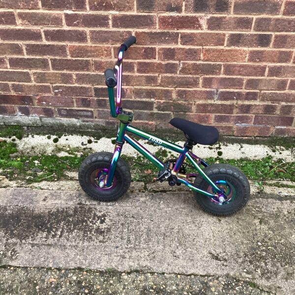 Iridescent 1080 mini bike, a small custom bicycle for stunts.