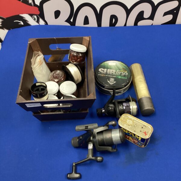 Vintage fishing reel lot including DAM Quick 120 and NGT reels with bait.